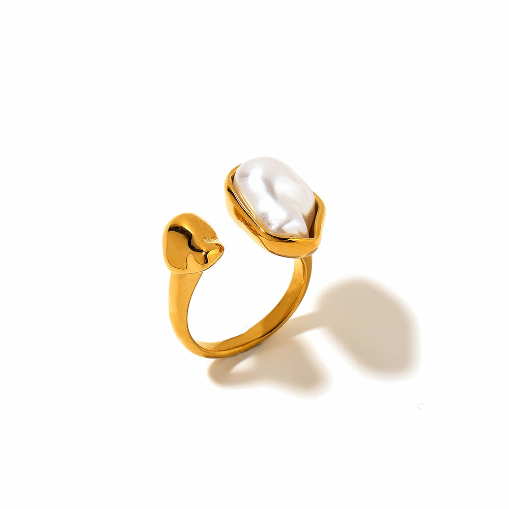 Vintage gold-tone open ring with irregular pearl-style centerpiece
