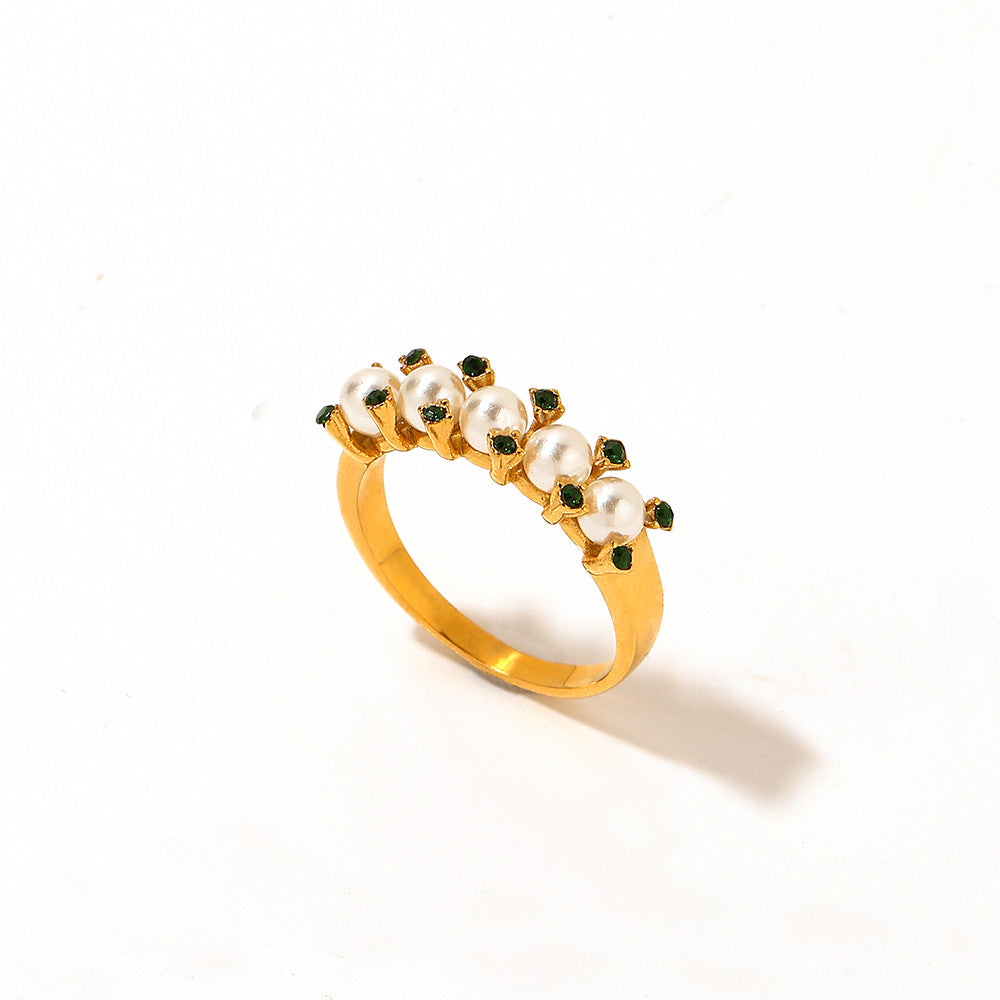 Vintage gold-tone ring with pearl-style and dark crystal accents