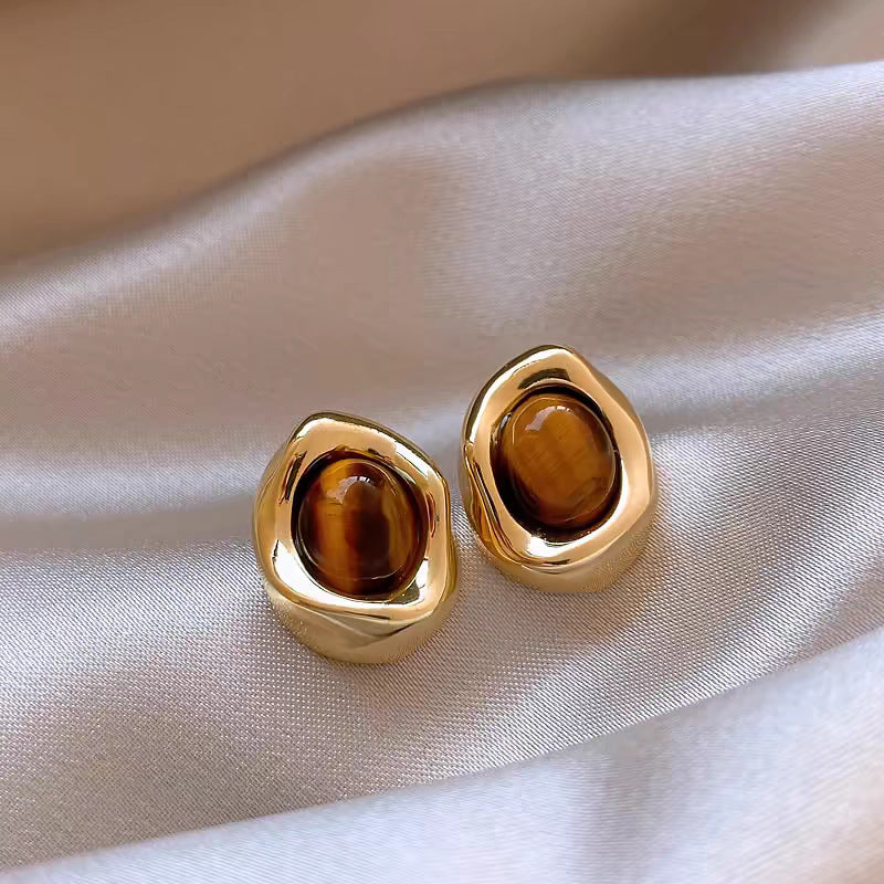 Caramel cat eye stud earrings with polished gold-tone frame