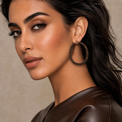 Arab woman wearing medium-sized brown leopard flocked hoop earrings