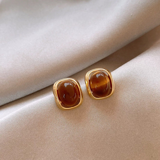 Brown amber square stud earrings with polished gold-tone frame
