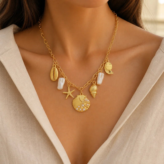 Ocean Charm Shell & Starfish Necklace worn with an ivory linen top